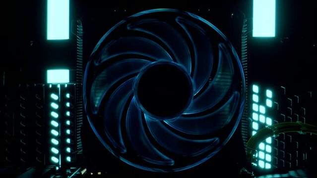 Close-up moving macro shot of the blue glowing cooler that spins and then stops. Movement from the center of the cooler to the general plan. Yellow cable and computer details on the motherboard of pc