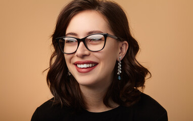 Happy young woman in stylish glasses