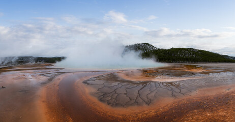 Hot spring Geyser with colorful water in American Landscape. Cloudy Sky Art Render. Yellowstone National Park, Wyoming, United States. Nature Background Panorama