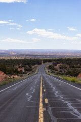 Scenic Road in the Dry Desert with Red Rocky Mountains in Background. Arizona, United States.