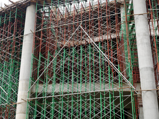 SELANGOR, MALAYSIA -JULY 4, 2021: Scaffolding is installed as temporary support for concrete formwork at the construction site. Installed according to the design approved by the engineer.