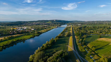 Aerial around of Benedictine Abbey on the rocky hill and Vistula River in Tyniec, near Krakow,...