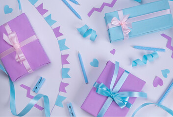  white background with candles, gift boxes, serpentine and holiday decorations in blue and lilac...