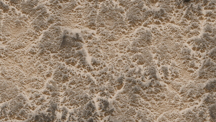 Sea foam with sand. Surface of clear water on tropical sandy ocean side in Crete Greece. Grit structure Particular spotlight on the stones, obscured foundation.Seascape from sea shore in summer seasos