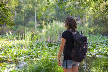 caucasian woman hiking in french forest