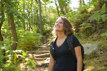 Fototapeta premium caucasian woman hiking in french forest