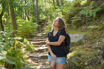 caucasian woman hiking in french forest