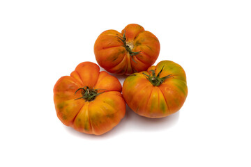 Three whole raf tomatoes, isolated on white background. Production focuses on winter and early spring, which are the most suitable times for consumption.