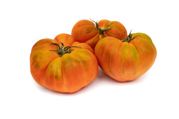 Three whole raf tomatoes, isolated on white background. Production focuses on winter and early spring, which are the most suitable times for consumption.