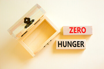 Zero hunger symbol. Concept words Zero hunger on wooden blocks on a beautiful white table white background. Empty wooden chest. Business, support and Zero hunger concept. Copy space.