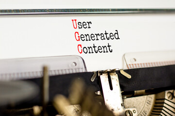 UGC user generated content symbol. Concept words UGC user generated content typed on the old retro...