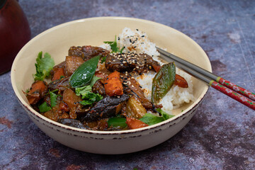 Korean eggplant and carrot fry over rice, plant based vegan bowl