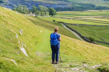 Walking along the Pennine Bridleway above Twistleton Scar between Chapel le Dale and Ingleton in thye Yorkshire Dales