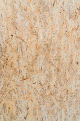 Yellow OSB plate texture, vertical photo