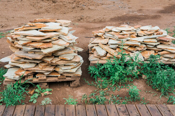 sandstone stones on pallets outdoors