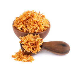 Roasted onions in wooden bowl and spoon, isolated on white background. Crispy fried onions.