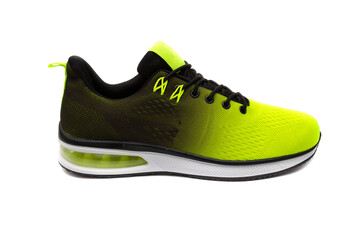 Trendy sports shoes, with a black and yellow color gradient, and white soles, isolated on white background.