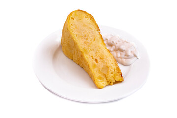 A plate with a piece of potato tortilla and mayonnaise, called in Spanish Tortilla Española. Isolated on white background