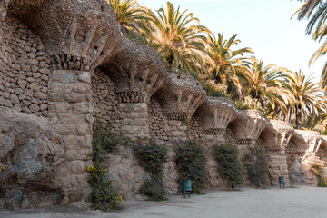 Stone columns and trees in Park Guell in Barcelona, Spain