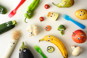 Variety of funny fruits and vegetables presented for children's nutrition