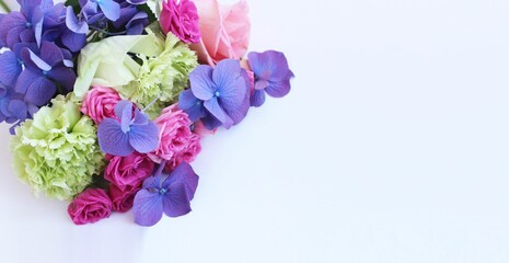 A festive bouquet with lilac hydrangea. A bright floral arrangement. Background for a greeting card.