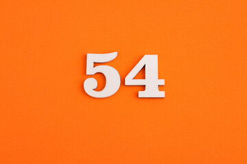 Number 54 - On orange foam rubber background