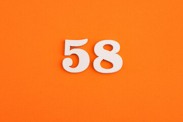 Number 58 - On orange foam rubber background