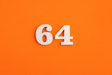 Number 64 - On orange foam rubber background