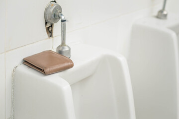 Forgotten wallets in public restrooms, forgetful persons, Alzheimer's disease, and aging bodies - obrazy, fototapety, plakaty
