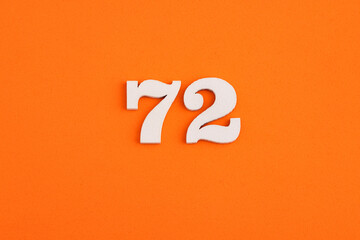 Number 72 - On orange foam rubber background