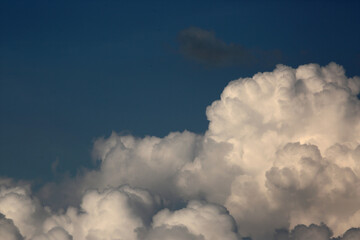 white fluffy clouds on blue sky. Weather concept