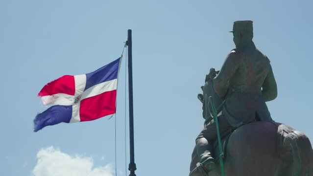 Dominican Republic flag and statue of General Gregorio Luperon in the Dominican Republic