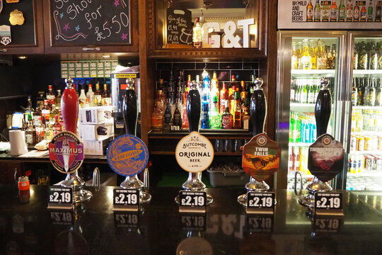 draft beer and larger pumps at the bar in a traditional  English pub 