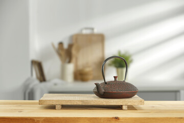 Wooden desk of free space and brown kettle in kitchen 