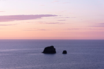 Sunset over sea with sea stack