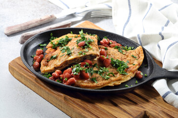 Simple hearty breakfast: homemade omelette with mushrooms, beans and parsley