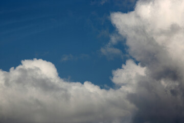 Fototapeta na wymiar white fluffy clouds on blue sky. Weather concept