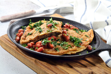 Simple hearty breakfast: homemade omelette with mushrooms, beans and parsley