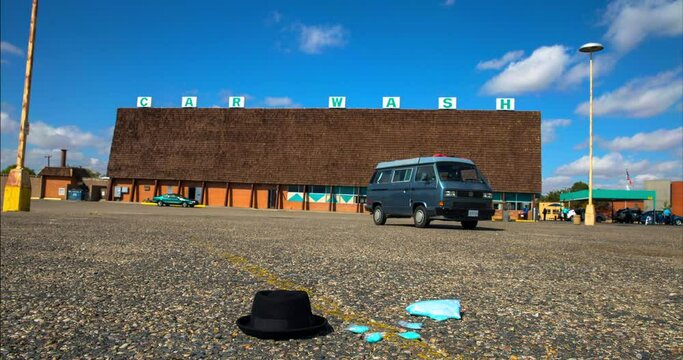 Time Lapse Lockdown Shot Of Black Hat And Blue Papers Over Car Wash Landscape Against Sky On Sunny Day - Albuquerque, New Mexico