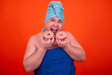 Breakfast and sports. Funny fat man eats donuts.	