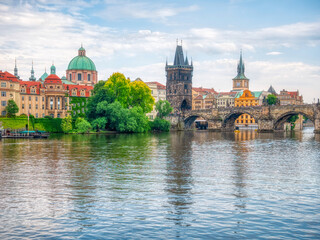  View with the Charles Bridge main touristic attraction . Medieval stone arch bridge over Vltava river in Prague