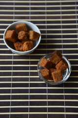 Peppered bread crackers with spices in plates