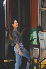 portrait of a woman with graffiti train