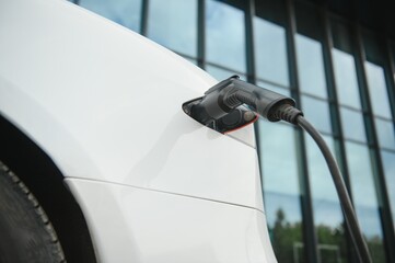 Close up image of the power socket of an electric car, charging