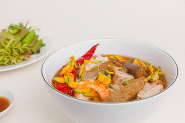 Bun mam, Vietnamese rice noodle soup with shrimp fish paste, Vietnamese food isolated on white background, close-up