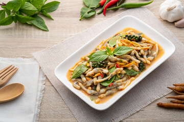 Stir Fried Razor clams with chilli and basil in white plate.Asian food