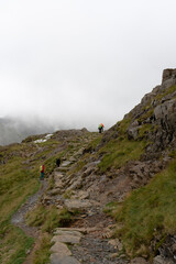 Fototapeta na wymiar Pyg miners track Snowdonia Mountain Snowdonia National Park North wales people hiking rambling
