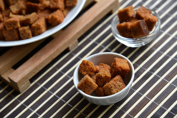 Spicy and spiced breadcrumbs on a white plate close-up.