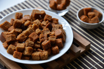 Spicy and spiced breadcrumbs on a white plate close-up.