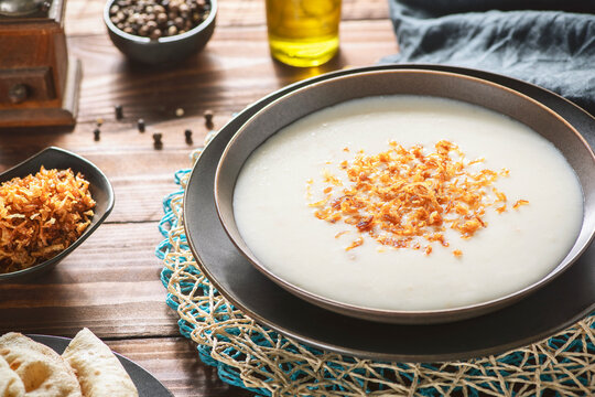 Arabic Cuisine; Egyptian traditional " Kishk Almaz". Kishk is a delicious savoury custard or porridge. It is made with yogurt, flour , broth and garnish with tasty caramelized onions.